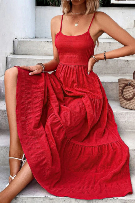 Flowy red tiered maxi dress featuring adjustable spaghetti straps, a smocked bodice for a flattering fit, and a lightweight textured fabric perfect for summer days. Ideal for vacations, date nights, or brunch with the girls.