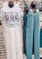 Light blue unisex t-shirt featuring bold "USA" block letters filled with a red, white, and blue floral pattern for a faux-embroidered look. Below, "EST. 1776" is printed in navy with red stars, celebrating American heritage. Classic crew neck and short sleeves offer a comfortable fit, perfect for patriotic holidays like the Fourth of July or Memorial Day.