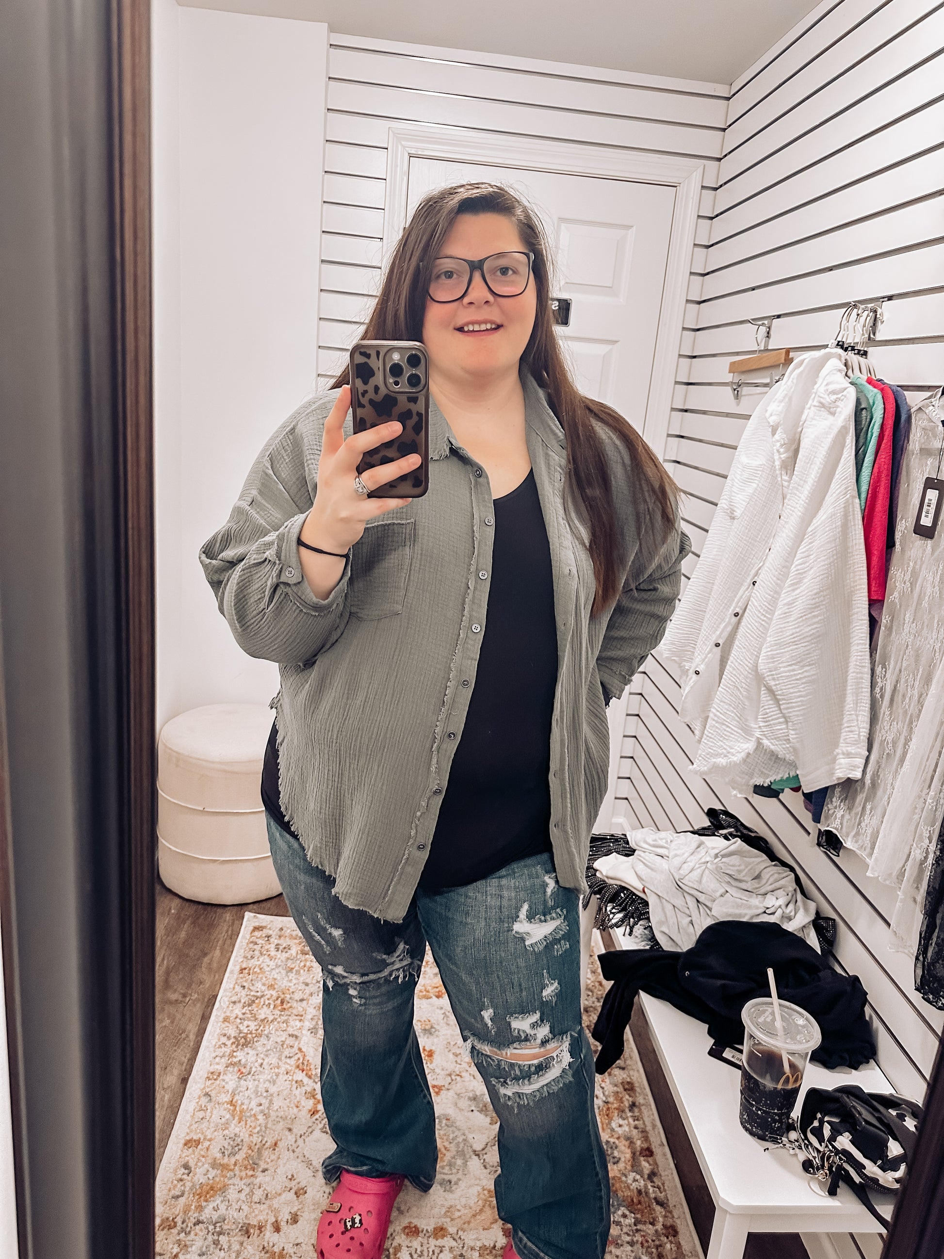 Women's oversized button-down shirt in light olive, crafted from a textured gauze fabric for a breathable and lived-in feel. Features raw-edge detailing on the collar and hem, front chest pocket, and functional button closures down the front. Drop shoulders and a relaxed fit make it ideal for layering over tanks or tees. A soft, casual essential for effortless cool-weather layering or breezy summer nights.