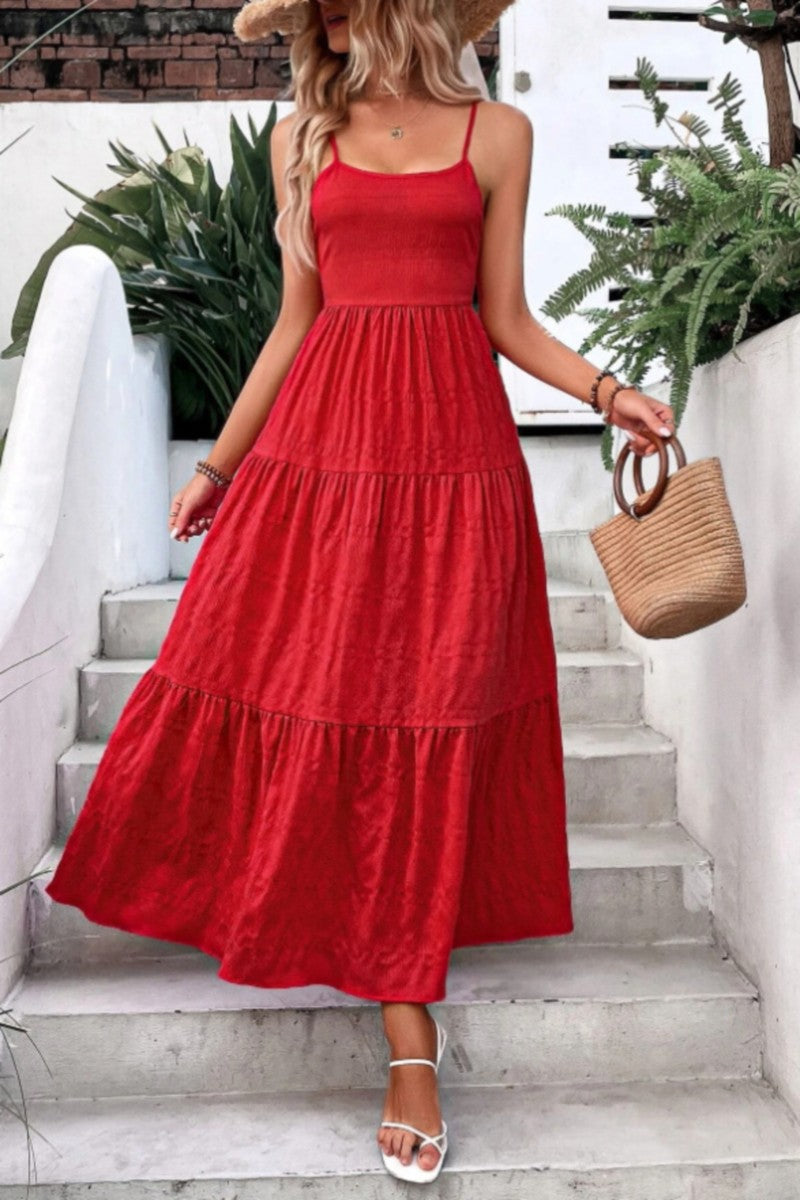 Flowy red tiered maxi dress featuring adjustable spaghetti straps, a smocked bodice for a flattering fit, and a lightweight textured fabric perfect for summer days. Ideal for vacations, date nights, or brunch with the girls.
