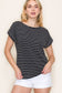 Woman wearing a black short-sleeve top with thin white horizontal stripes, a classic crew neckline, and rolled cuff sleeves with button accents. The top features a relaxed, drapey fit that pairs effortlessly with white cuffed shorts for a crisp, casual look. Perfect for everyday wear, this lightweight striped tee brings timeless style and comfort to your summer wardrobe.