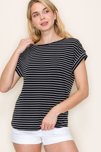 Woman wearing a black short-sleeve top with thin white horizontal stripes, a classic crew neckline, and rolled cuff sleeves with button accents. The top features a relaxed, drapey fit that pairs effortlessly with white cuffed shorts for a crisp, casual look. Perfect for everyday wear, this lightweight striped tee brings timeless style and comfort to your summer wardrobe.