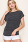 Woman wearing a black short-sleeve top with thin white horizontal stripes, a classic crew neckline, and rolled cuff sleeves with button accents. The top features a relaxed, drapey fit that pairs effortlessly with white cuffed shorts for a crisp, casual look. Perfect for everyday wear, this lightweight striped tee brings timeless style and comfort to your summer wardrobe.