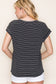 Woman wearing a black short-sleeve top with thin white horizontal stripes, a classic crew neckline, and rolled cuff sleeves with button accents. The top features a relaxed, drapey fit that pairs effortlessly with white cuffed shorts for a crisp, casual look. Perfect for everyday wear, this lightweight striped tee brings timeless style and comfort to your summer wardrobe.