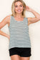 Woman wearing a casual sleeveless tank top with horizontal forest green and white stripes. The top features a scoop neckline and a relaxed, slightly flared silhouette that offers a breezy, comfortable fit. Styled with distressed dark-wash denim shorts, this easygoing look is perfect for everyday wear, beach days, or layering under summer cardigans and jackets.