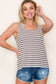 Woman wearing a casual sleeveless tank top with horizontal taupe and white stripes. The top features a scoop neckline and a relaxed, slightly flared silhouette that offers a breezy, comfortable fit. Styled with distressed dark-wash denim shorts, this easygoing look is perfect for everyday wear, beach days, or layering under summer cardigans and jackets.