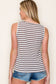 Woman wearing a casual sleeveless tank top with horizontal taupe and white stripes. The top features a scoop neckline and a relaxed, slightly flared silhouette that offers a breezy, comfortable fit. Styled with distressed dark-wash denim shorts, this easygoing look is perfect for everyday wear, beach days, or layering under summer cardigans and jackets.