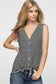 Woman wearing a sleeveless black and white horizontal striped tank top with a deep V-neckline and functional wooden buttons down the front. The top features a trendy front tie detail at the hem, creating a casual, flattering silhouette. Made from a soft, lightweight fabric, it's styled with medium-wash denim jeans—perfect for laid-back summer days, weekend outings, or everyday wear.