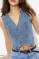 Light wash denim vest top featuring a tailored V-neckline, angled hemline, and asymmetrical button-down front. This sleeveless piece adds a vintage-meets-modern vibe to any outfit and pairs perfectly with high-rise jeans or shorts for an edgy, casual-cool look.