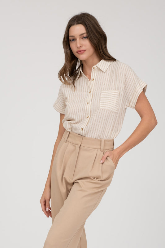 Short-sleeve button-up shirt in a neutral cream and tan stripe pattern, featuring a collared neckline and a chest pocket with horizontal stripe contrast. Lightweight, breathable fabric with a relaxed fit for everyday wear. A versatile top that pairs effortlessly with denim, trousers, or shorts for a casual yet polished look.