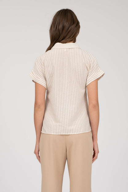 Short-sleeve button-up shirt in a neutral cream and tan stripe pattern, featuring a collared neckline and a chest pocket with horizontal stripe contrast. Lightweight, breathable fabric with a relaxed fit for everyday wear. A versatile top that pairs effortlessly with denim, trousers, or shorts for a casual yet polished look.