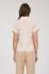 Short-sleeve button-up shirt in a neutral cream and tan stripe pattern, featuring a collared neckline and a chest pocket with horizontal stripe contrast. Lightweight, breathable fabric with a relaxed fit for everyday wear. A versatile top that pairs effortlessly with denim, trousers, or shorts for a casual yet polished look.