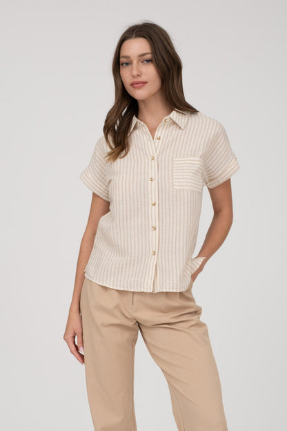 Short-sleeve button-up shirt in a neutral cream and tan stripe pattern, featuring a collared neckline and a chest pocket with horizontal stripe contrast. Lightweight, breathable fabric with a relaxed fit for everyday wear. A versatile top that pairs effortlessly with denim, trousers, or shorts for a casual yet polished look.