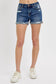 Medium-wash denim shorts featuring a mid-rise fit, cuffed raw hem, and distressed details throughout the front and pockets. These shorts blend laid-back edge with everyday comfort thanks to the soft stretch denim and versatile length. The perfect pair for casual summer days, music festivals, or throwing on over a swimsuit.