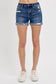 Medium-wash denim shorts featuring a mid-rise fit, cuffed raw hem, and distressed details throughout the front and pockets. These shorts blend laid-back edge with everyday comfort thanks to the soft stretch denim and versatile length. The perfect pair for casual summer days, music festivals, or throwing on over a swimsuit.