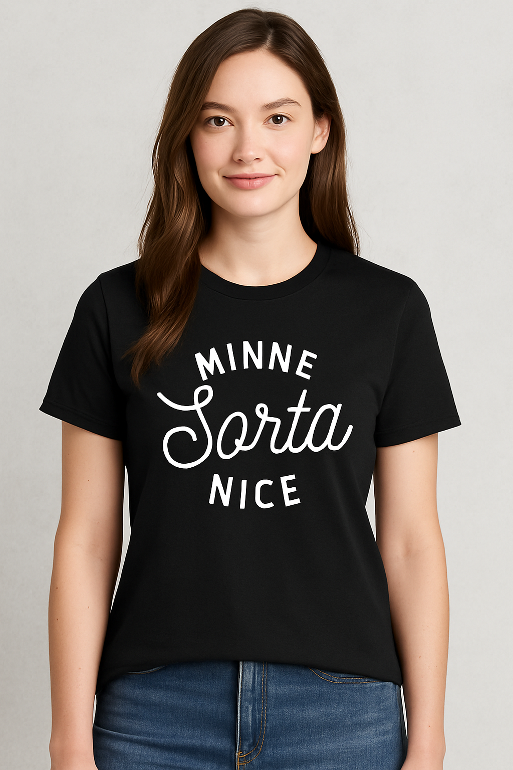 Black short-sleeve crewneck tee featuring bold white text that reads “MINNE Sorta NICE” in a mix of block and script fonts. Made from a soft, lightweight cotton blend with a relaxed unisex fit. A cheeky nod to Minnesota culture—equal parts charm and sass. Perfect for layering or wearing solo with jeans and sneakers for a casual Midwest-cool vibe.