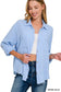 Lightweight and breezy button-down shirt in a soft, crinkled gauze fabric, featured in a fresh Spring Blue. Designed with dual chest pockets, raw-edge hem, and rolled long sleeves with button tabs. Slightly oversized fit for easy layering over tanks, tees, or swimsuits—perfect for casual days, lake life, or cool summer nights.