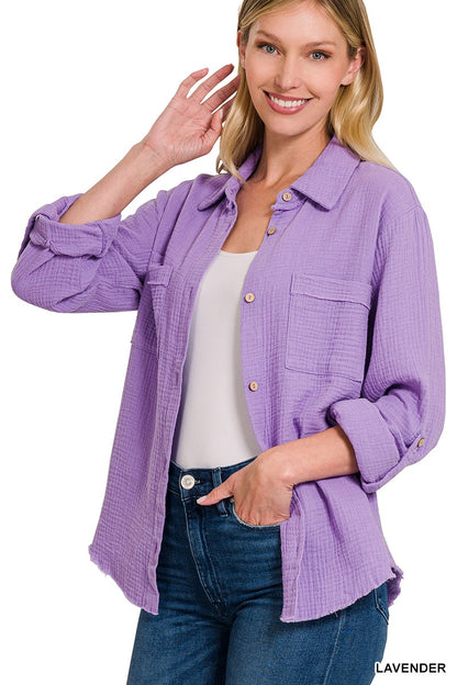 Textured lavender button-down shirt with a relaxed, oversized fit and lightweight gauze fabric. Features raw-edge hems, double chest pockets, wood-look buttons, and roll-tab sleeves. A breezy, versatile layer for spring and summer that pairs effortlessly with denim, tanks, or swimwear.