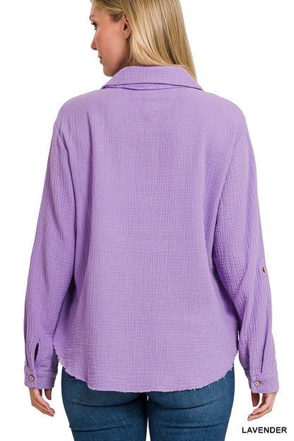 Textured lavender button-down shirt with a relaxed, oversized fit and lightweight gauze fabric. Features raw-edge hems, double chest pockets, wood-look buttons, and roll-tab sleeves. A breezy, versatile layer for spring and summer that pairs effortlessly with denim, tanks, or swimwear.