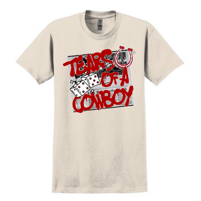 Beige graphic tee featuring a bold red "Tears of a Cowboy" slogan layered over a black-and-white rodeo newspaper print. Accents include dice, a horseshoe, and distressed lettering for an edgy Western-meets-streetwear vibe. Perfect for rodeo rebels, heartbreak cowgirls, or anyone living on the wild side of the saddle.